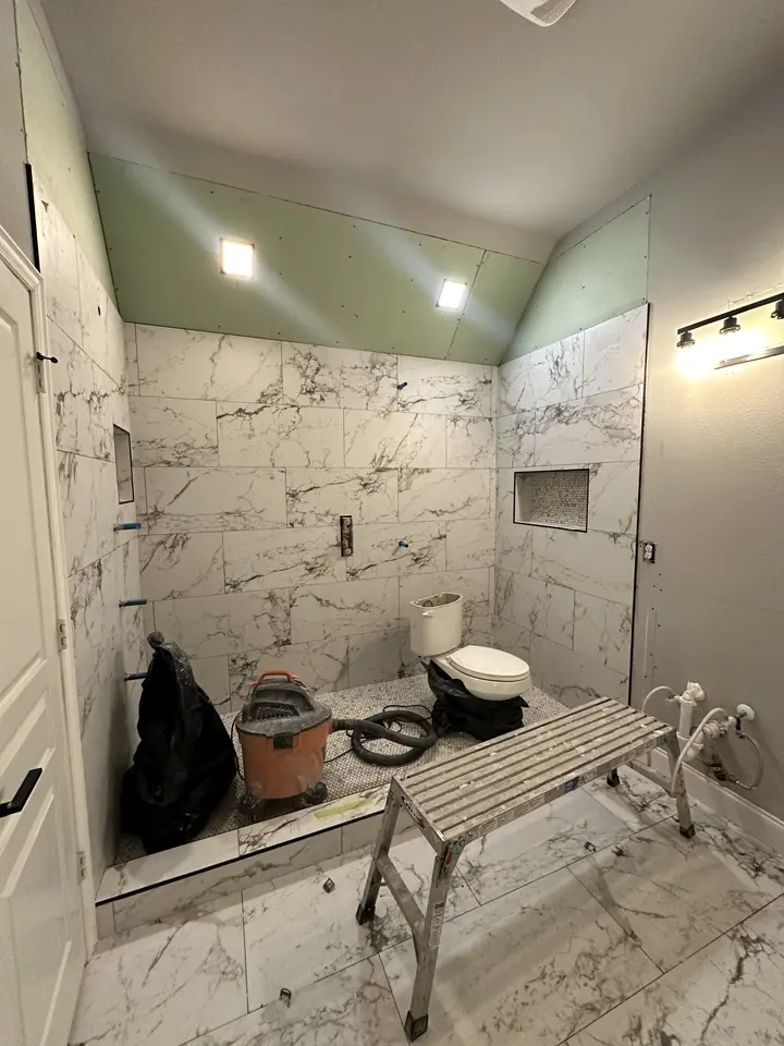 Shower tile complete with niche, ready for fixtures and glass