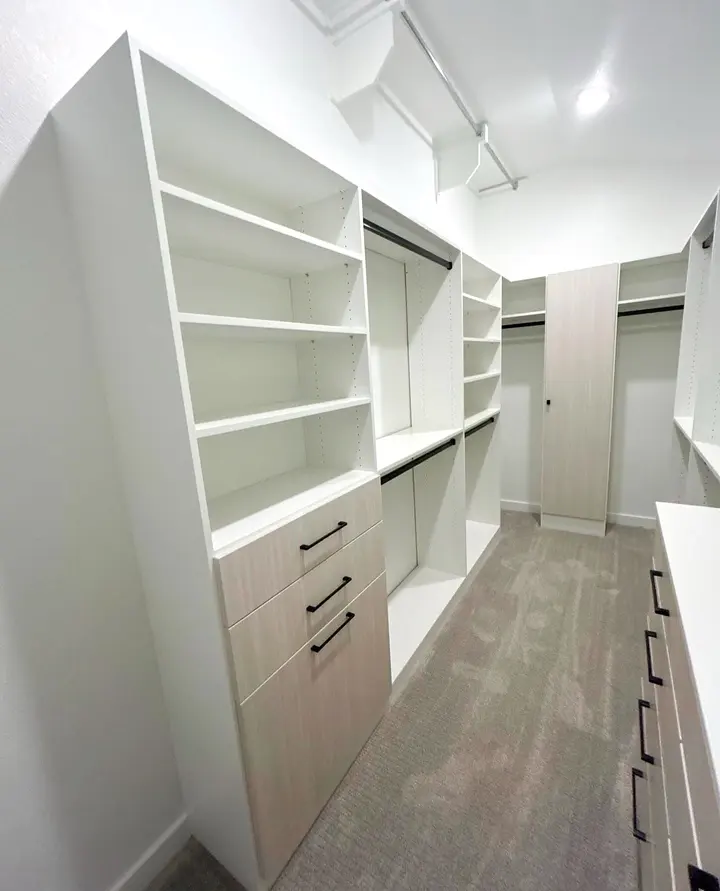 Closet shelving tower with oak drawers and double hanging rods